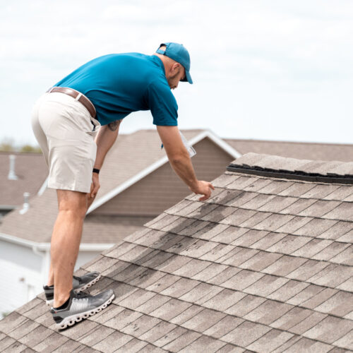 Project Manager Evaluating Roof